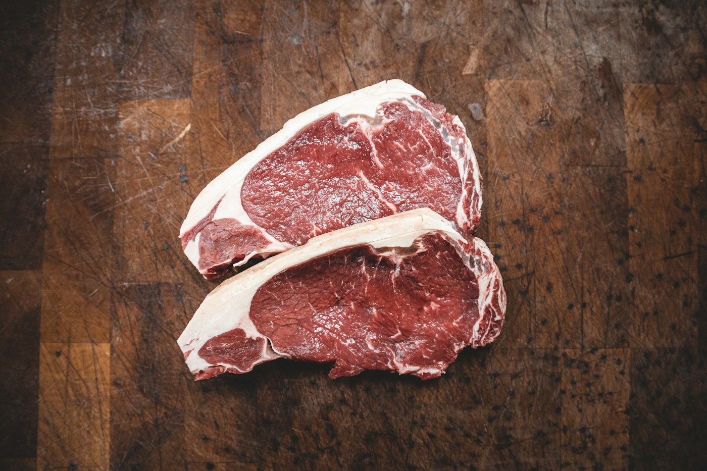 Sirloin steaks on the butcher board